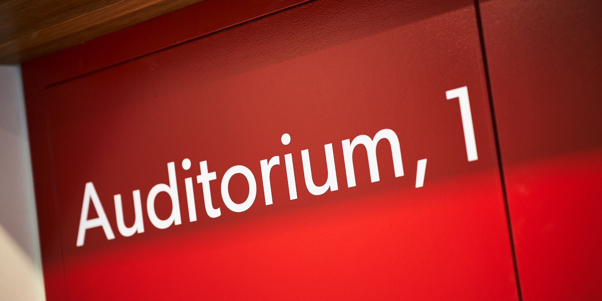 A red sign with the text 'Auditorium 1' on it.