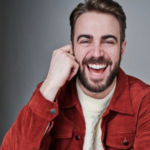 Laughing white man with red jacket