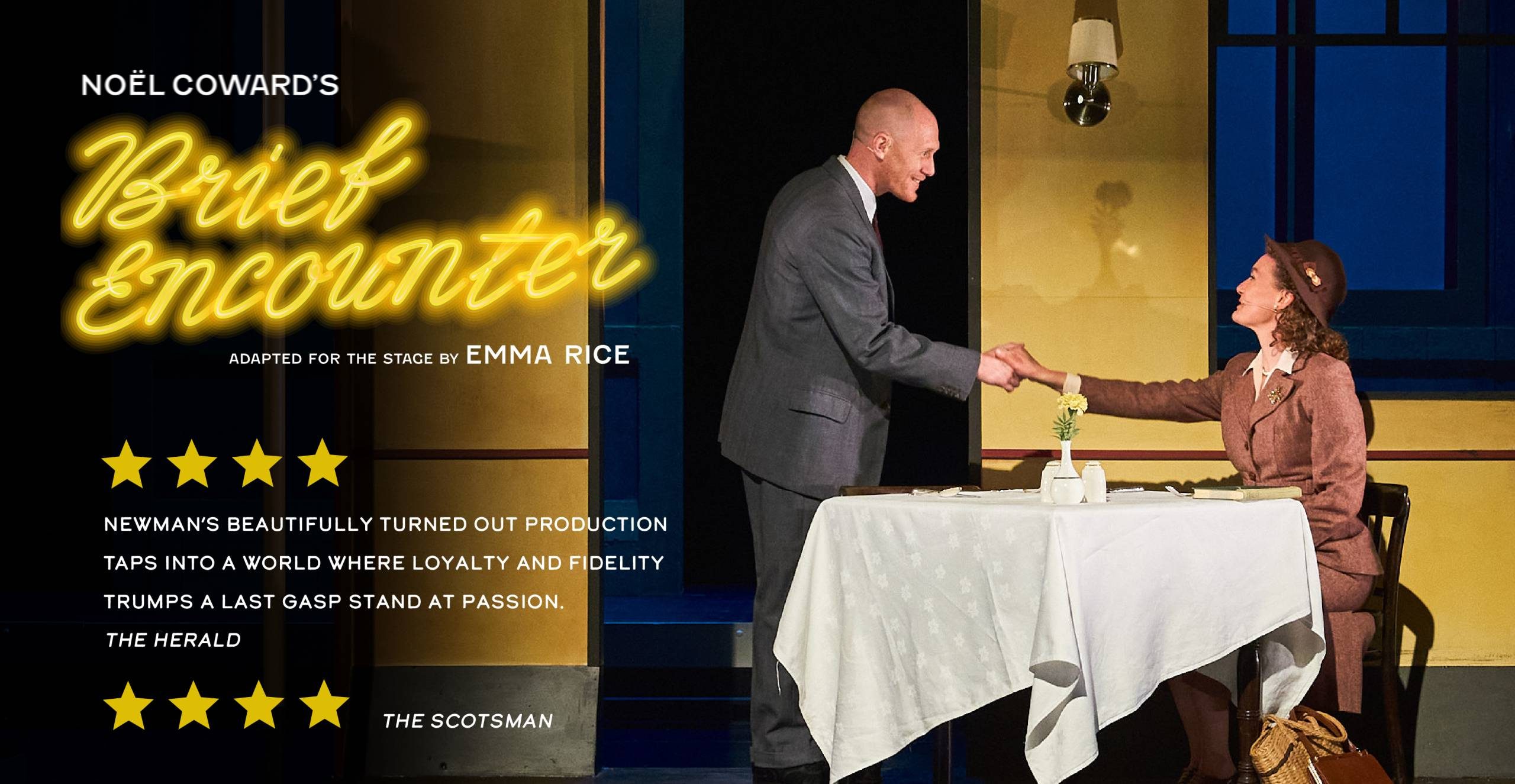 A man and woman holding hands across a table.