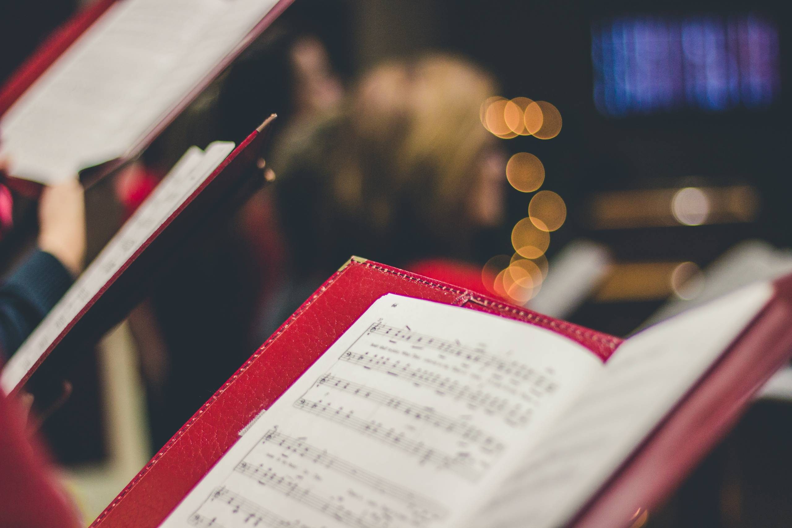 Sheet music in red folder.