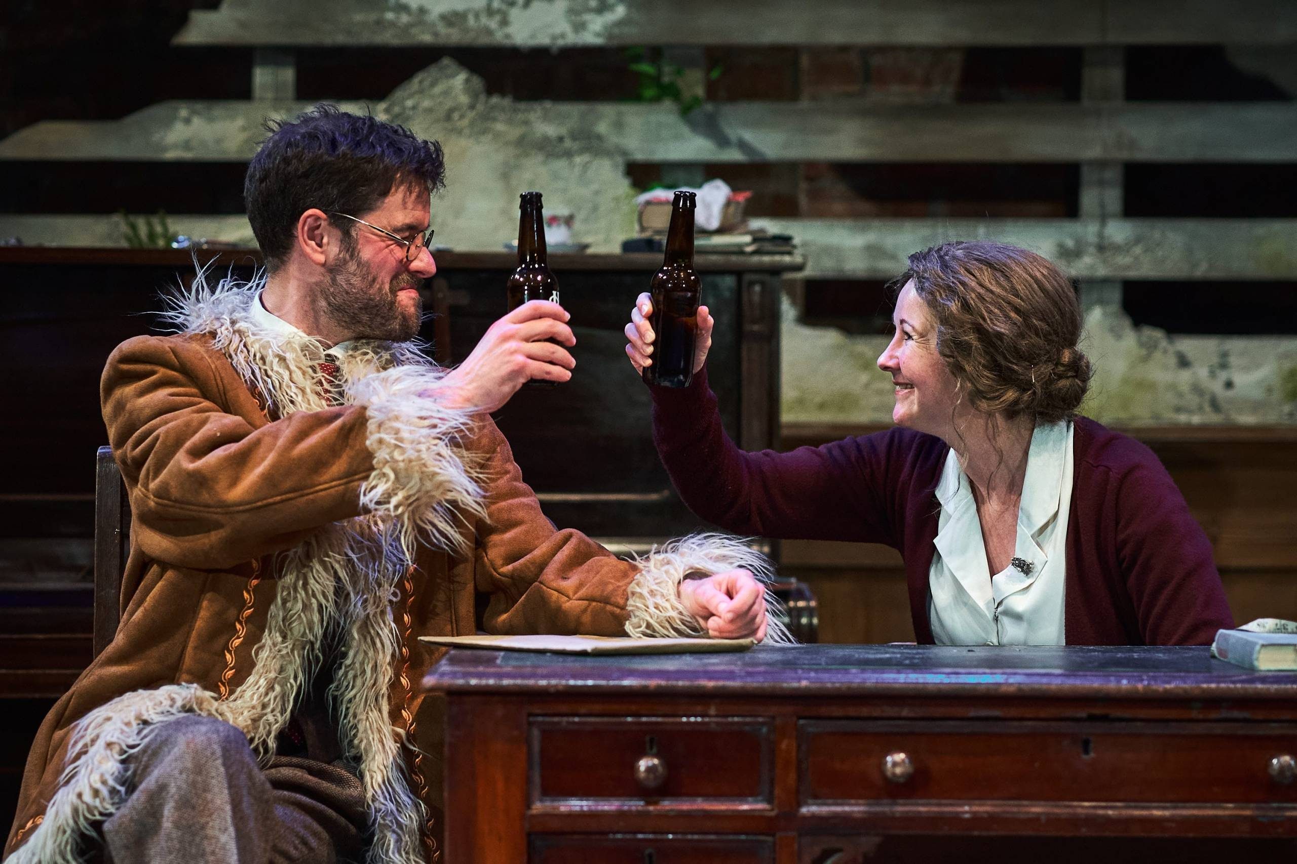 Two people sharing beers