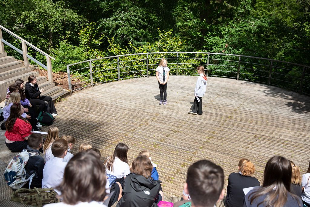 Children performing on an outdoor stage